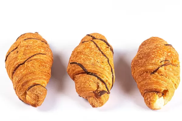Croissants with chocolate on a white background