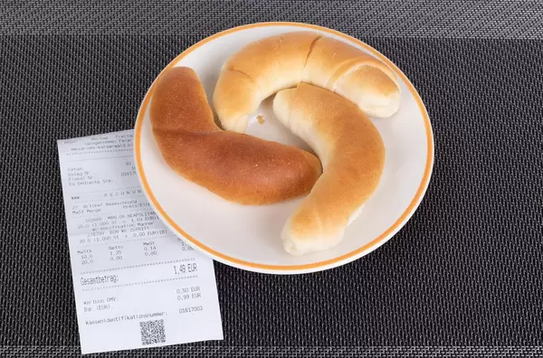 Croissants with reciept on table