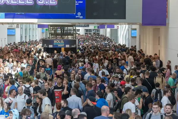 Crowded Exhibition Hall: Visitors at games fair "Gamescom" in Cologne, Germany