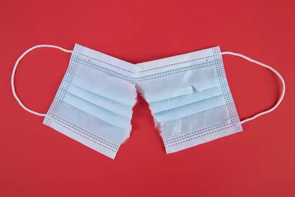 Crumpled used disposable medical face mask