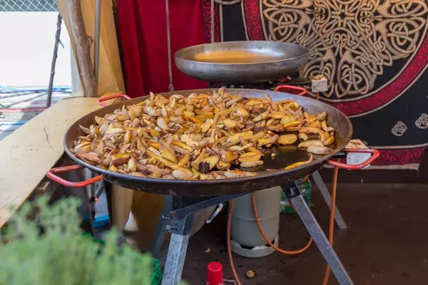 Crunchy roast potato in large frying pan