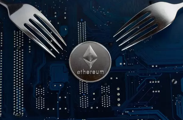 Cryptocurrency generated platform Ethereum with forks on a motherboard
