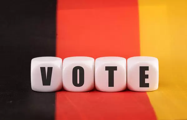 Cubes with Vote text on German flag