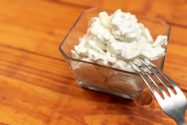 Cucumber-Salad-mixed-with-Onions-and-Sour-Cream.jpg