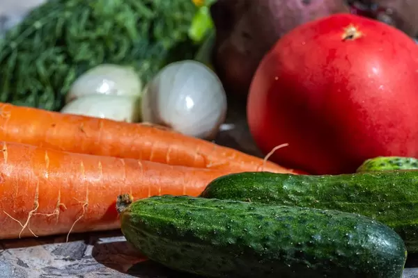 Cucumbers, carrots, onions, tomato and beets - healthy food