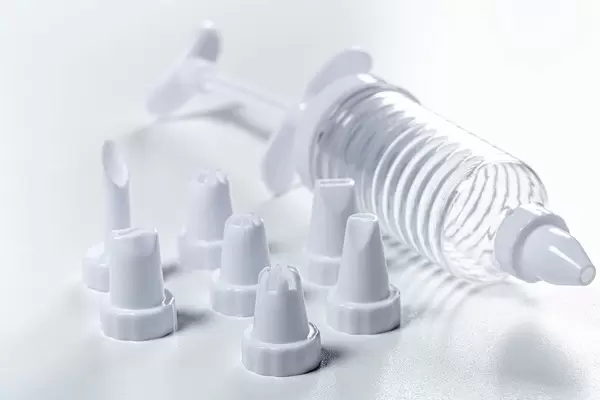 Culinary syringe with tips on white background (Flip 2019)