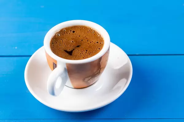 Cup of Coffee on the blue wooden table (Flip 2019)