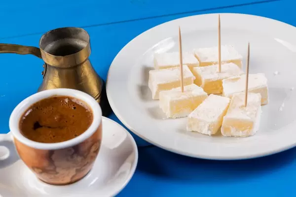 Cup of Coffee with Turkish Delight in the background (Flip 2019)