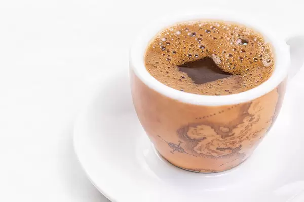 Cup of Coffee with world map and copy space