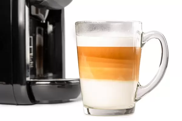 Cup of hot caramel latte macchiato