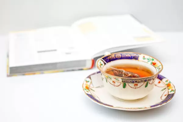 Cup of Tea with Book in the Background