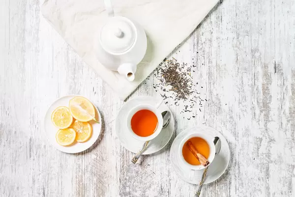 Cups of herbal tea and lemon slices