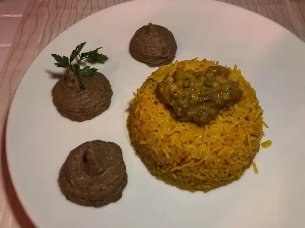 Curry rice with linsen dal on white table