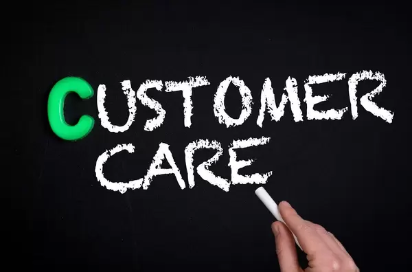 Customer care text on blackboard