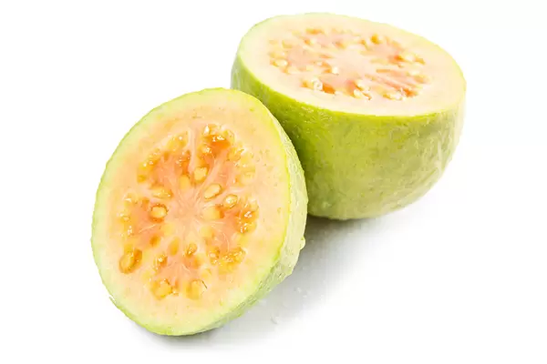 Cut two halves of a juicy guava