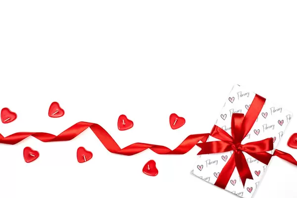 Cute Valentine day composition with present and red candles
