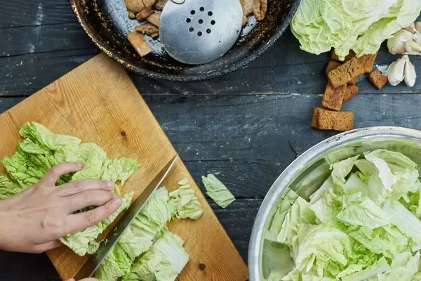 Cutting savoy cabbage for salad