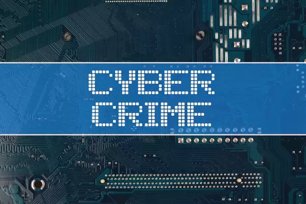 Cyber Crime text over electronic circuit board background