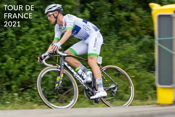 Cyclist at a bicycle race, next to the text "Tour de France 2021".
