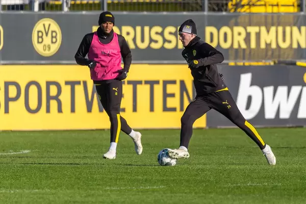 Danish player Jacob Bruun Larsen faces Manuel Akanji during a Borussia Dortmund training