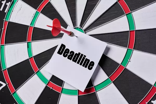Dart arrow hitting deadline note