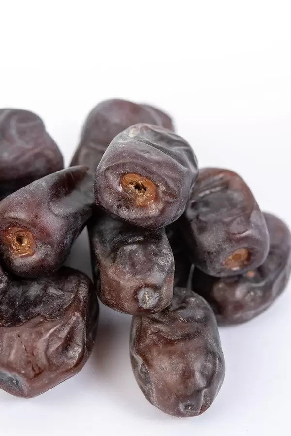 Date palm fruits on the white background