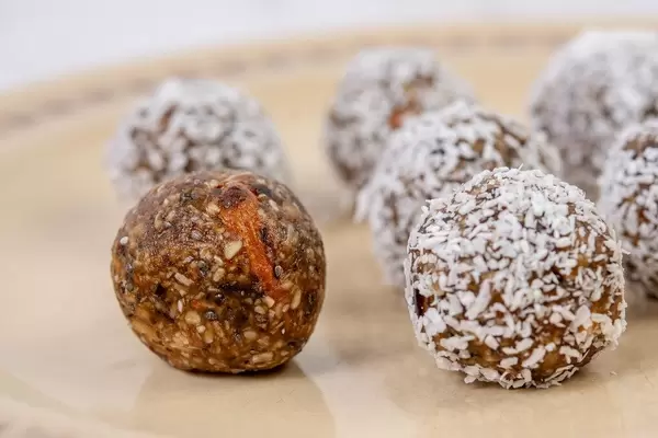 Dates and Peanut Butter energy balls cookies on the plate (Flip 2019)