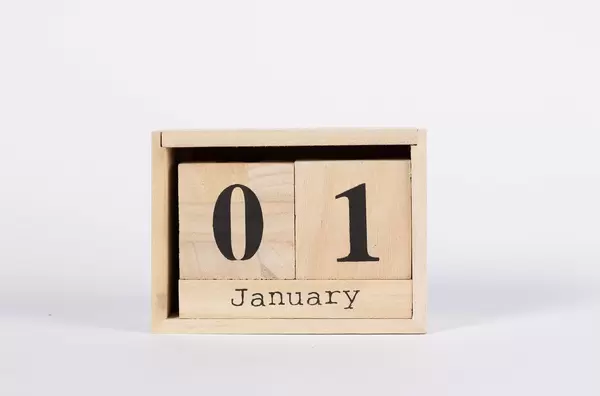 Day 1st of January set on wooden calendar