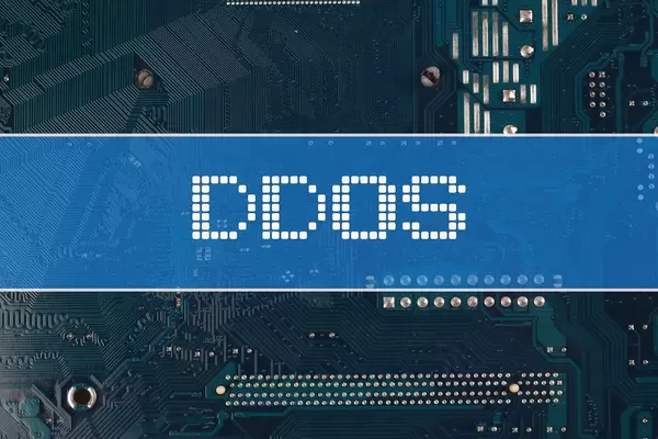 DDOS text over electronic circuit board background