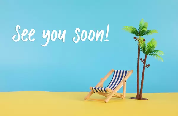 Deck chair, palm tree and See you Soon text
