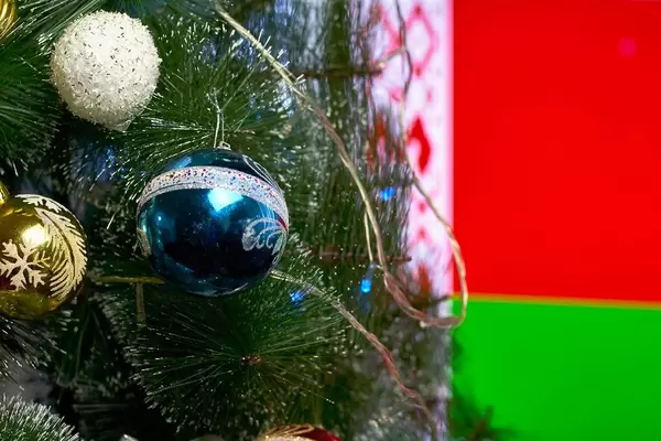 Decorated Christmas tree against the Belarus flag