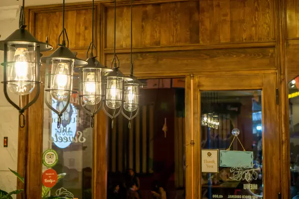 Decorative Hanging Lights with Light Bulbs inside a Cafe iwith Wooden Design