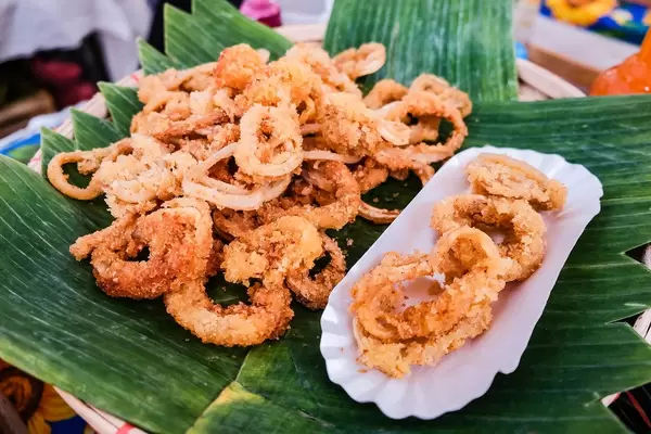 Deep fried calamares served on banana leaves
