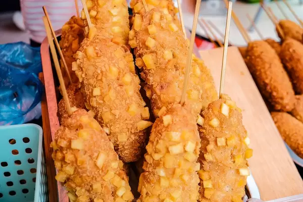 Deep fried corn dogs with potato bits