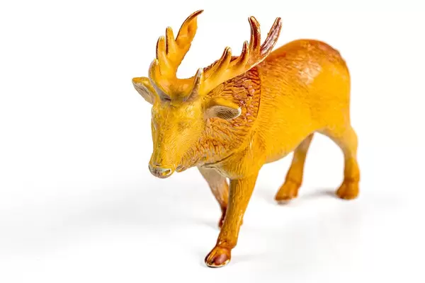 Deer plastic figure on a white background