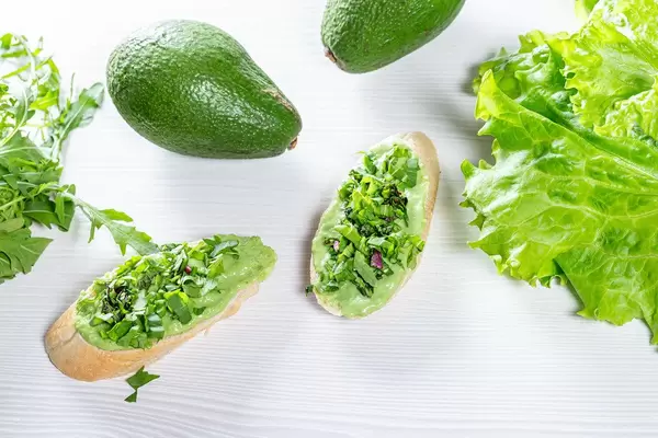 Delicious and healthy food with green sandwiches, avocado and lettuce (Flip 2019)