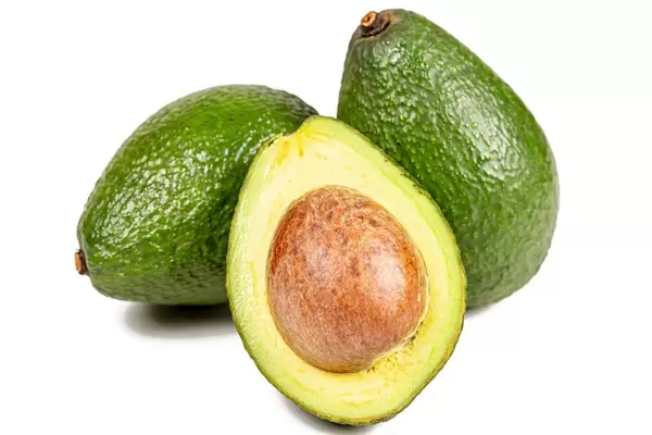 Delicious and healthy fresh avocado on white background