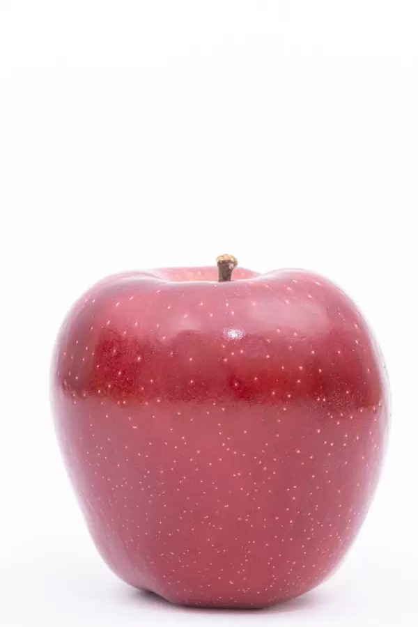 Delicious and Healthy Red Apple above white background