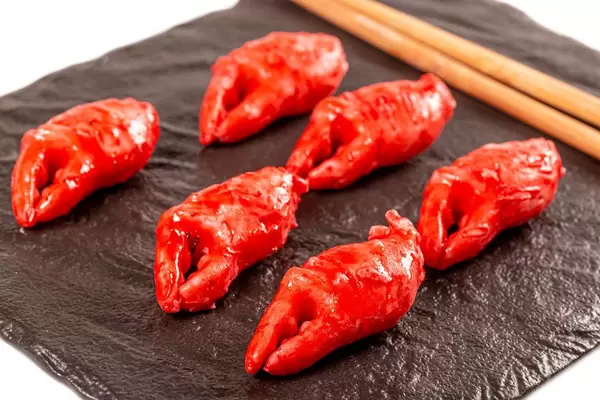 Delicious appetizer - crab claws in a spicy sauce