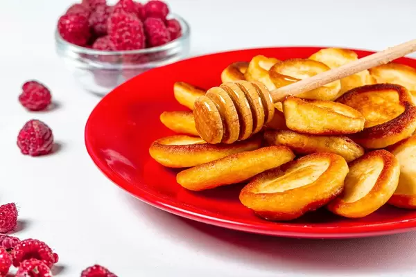 Delicious breakfast with pancakes and raspberries