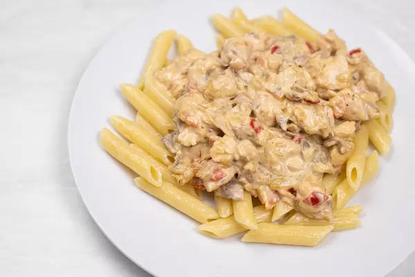 Delicious Chicken with Mushrooms and Macaroni served on the plate