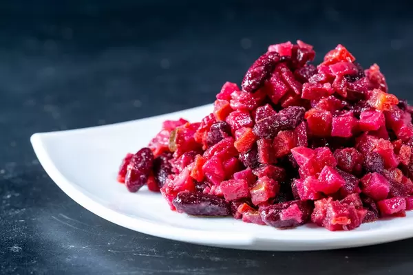 Delicious diet salad with beets, carrots, potatoes, beans and pickles