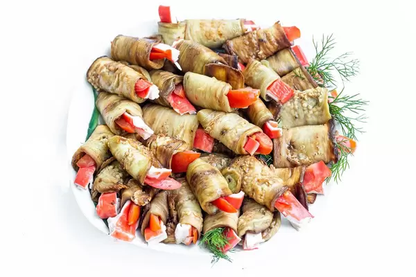 Delicious eggplant rolls on a white plate. Top view (Flip 2019)