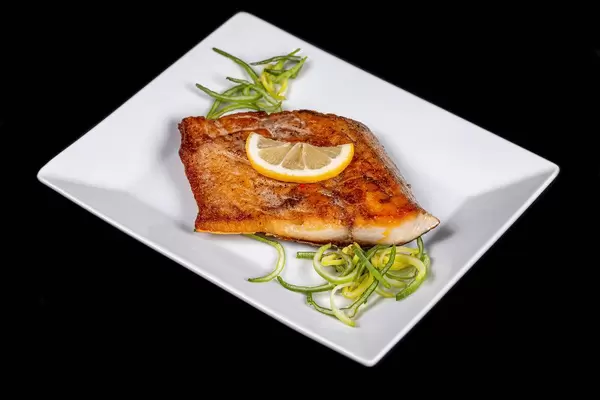 Delicious fried tuna fillet with lemon and leek