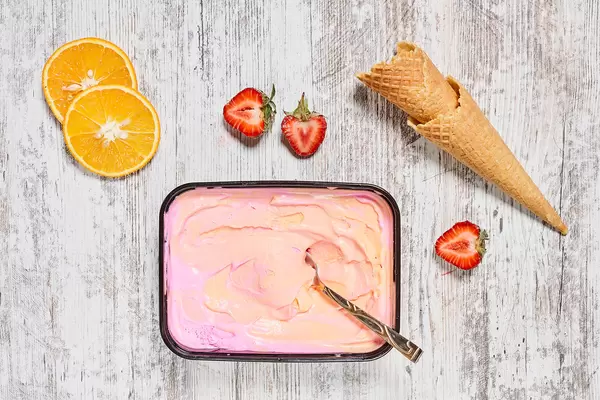 Delicious ice cream with lemon and strawberry fruits