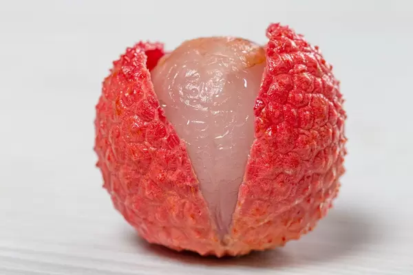 Delicious juicy red lychee over white background (Flip 2019)