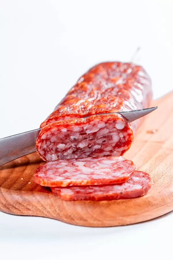 Delicious sliced sausages on table  Flip 2019