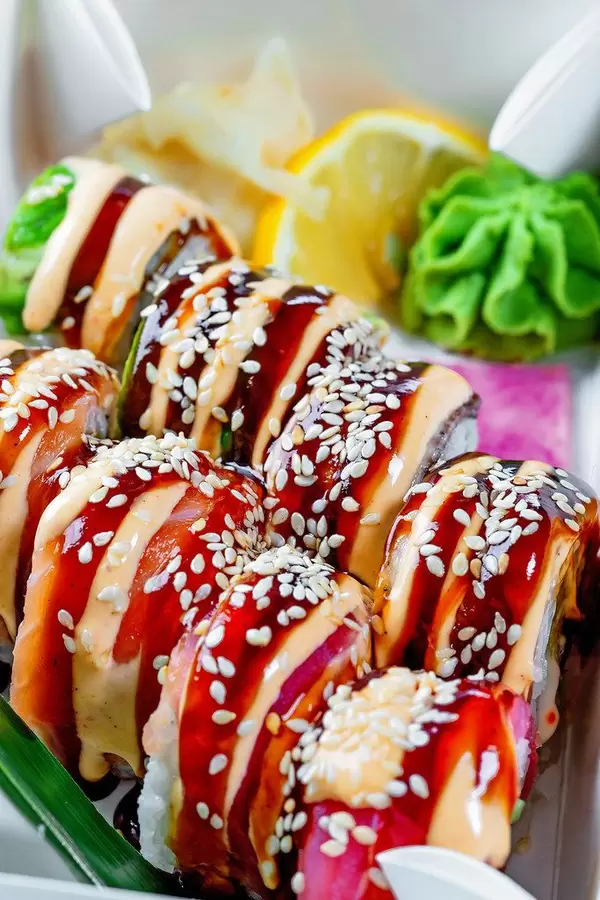 Delicious sushi with lemon, wasabi and ginger