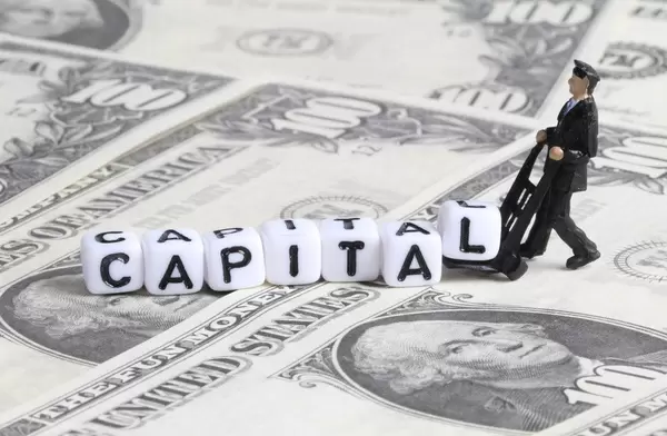 Delivery guy with Capital text on Dollar banknotes