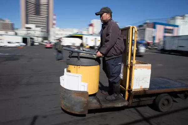 Deliveryman at the fish market in Tokyo